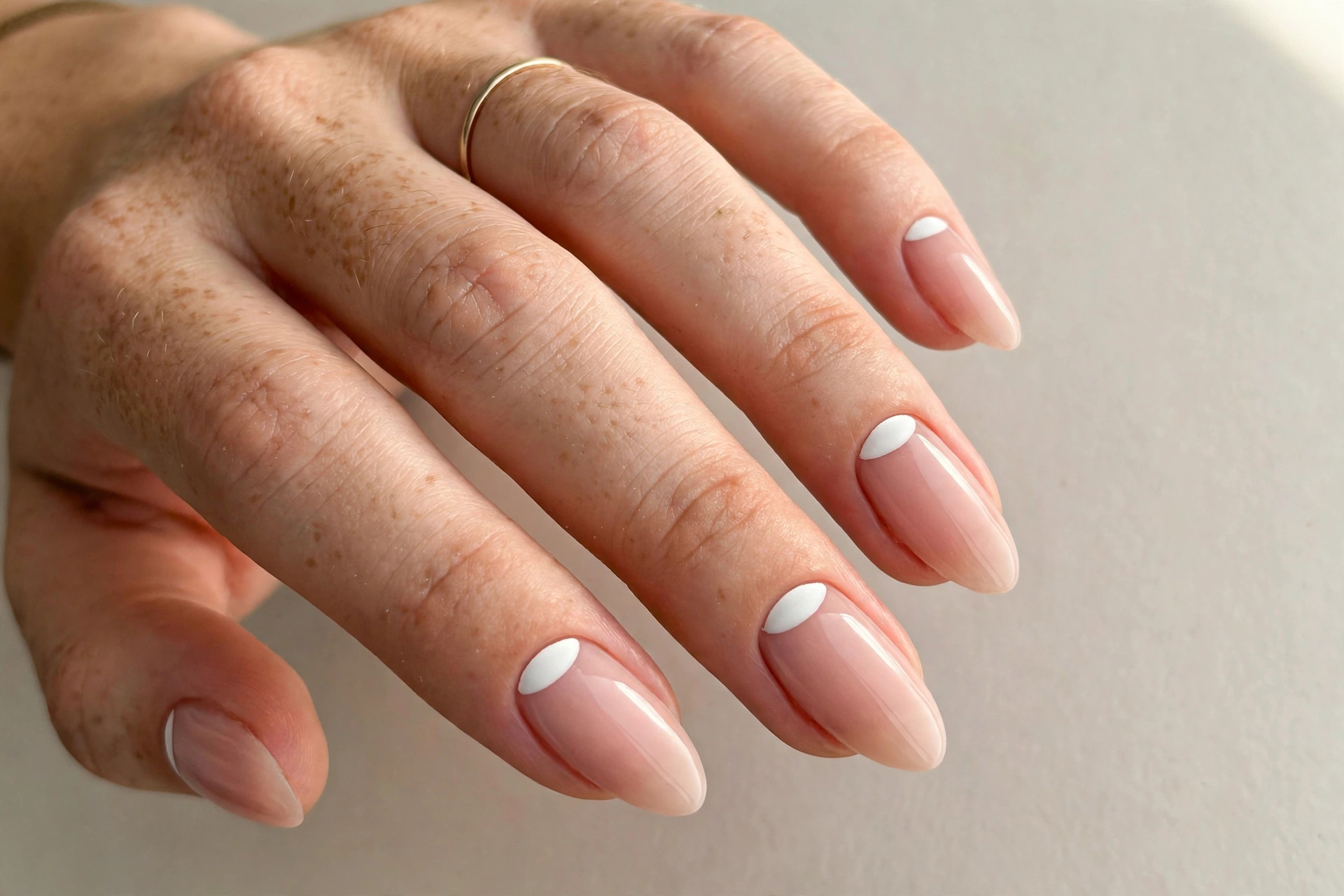 Reverse white French manicure with white at the cuticle