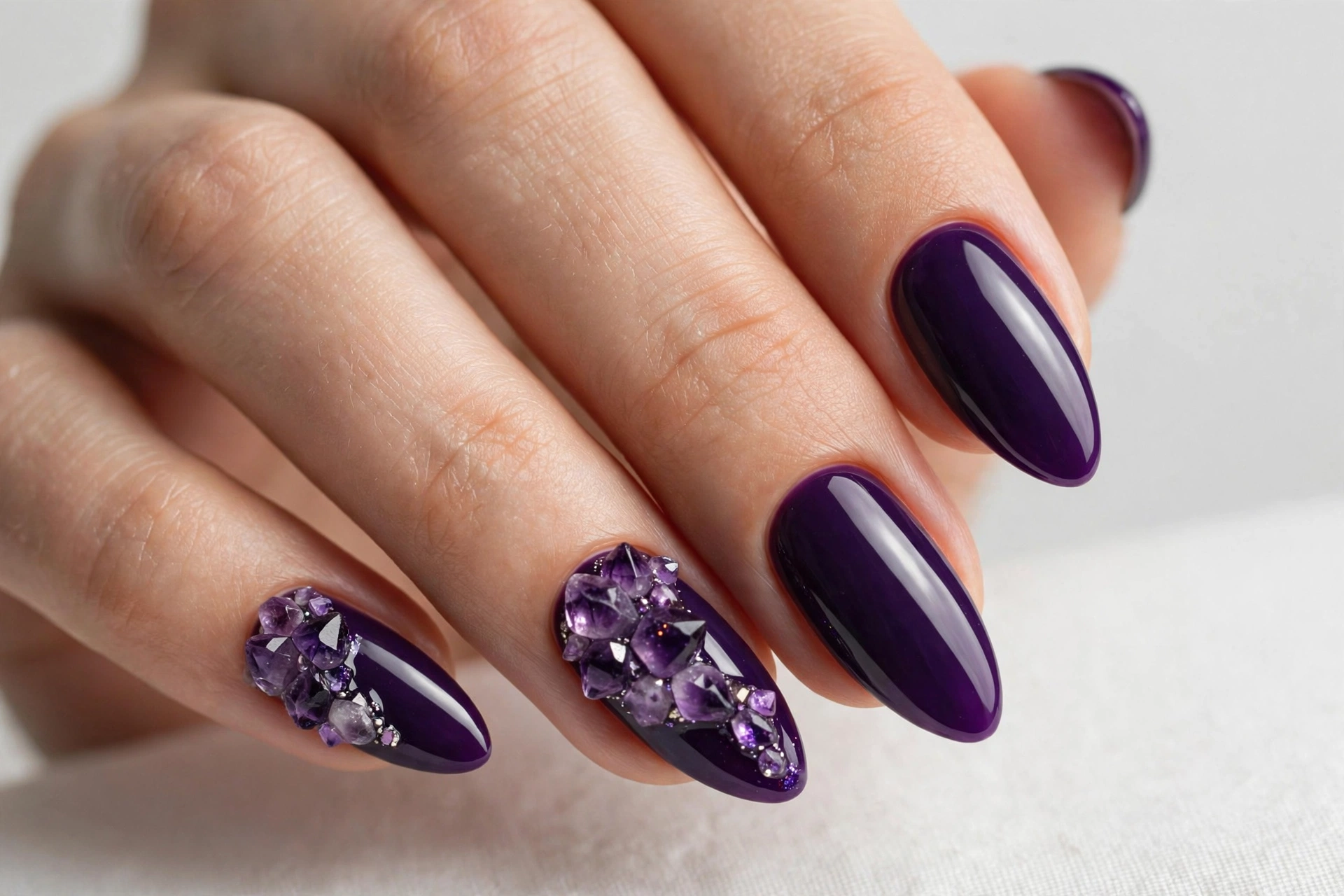 Deep violet nails with sparkling amethyst crystal clusters