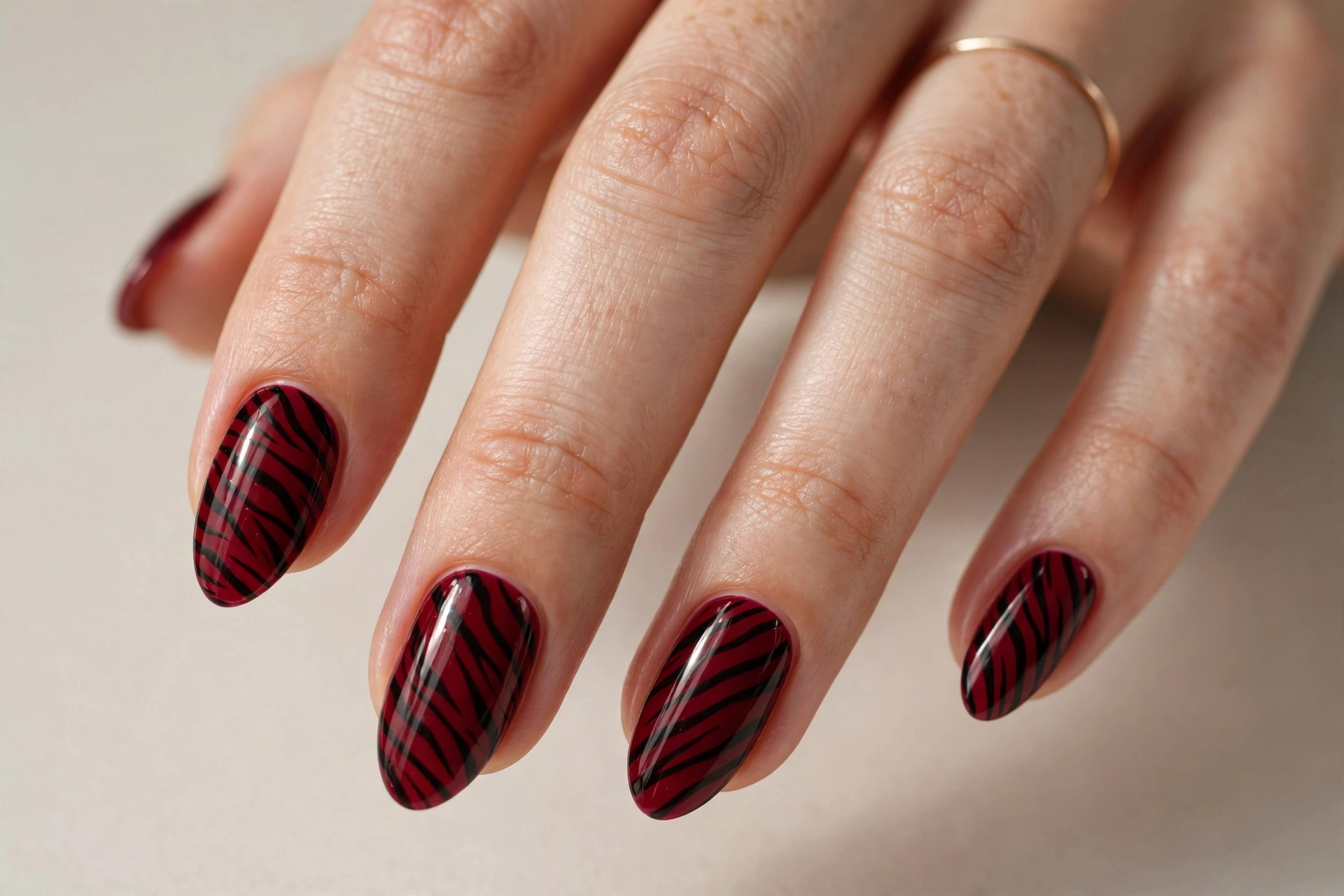 Deep red zebra stripe nails with black stripes