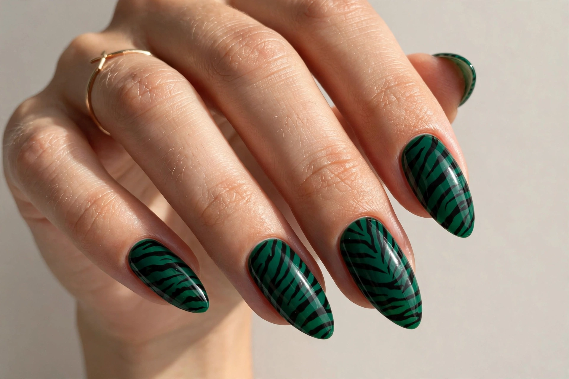 Emerald green zebra stripe manicure
